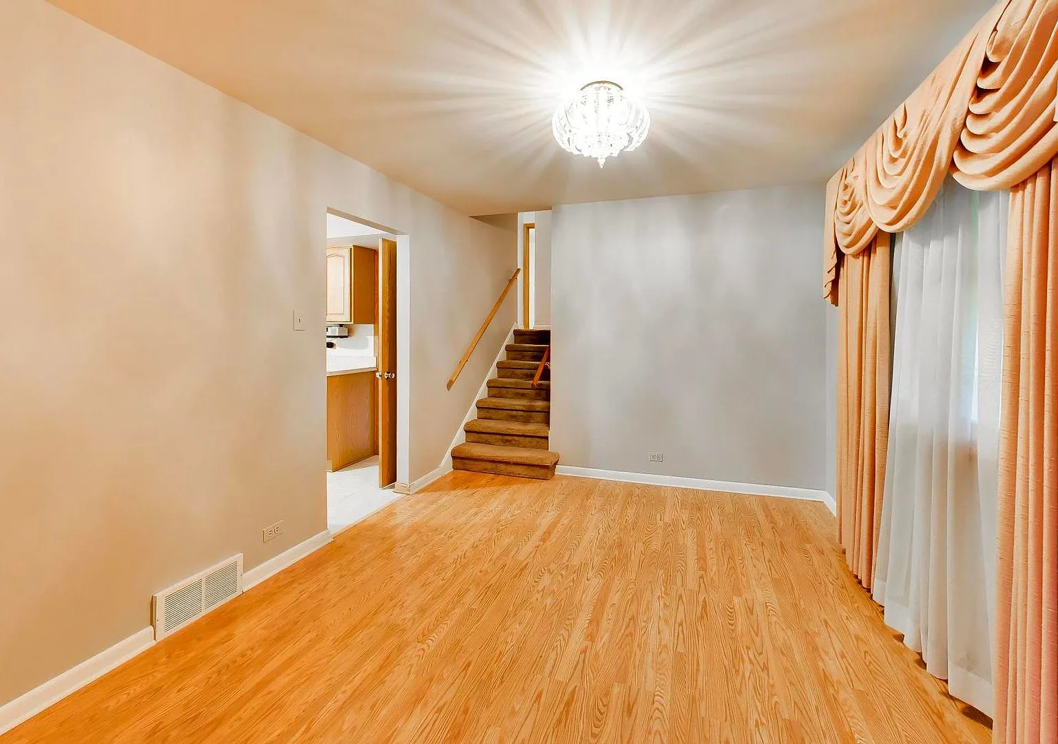 Living room with stairs leading to another level