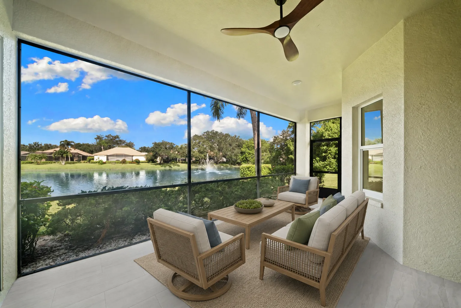 Screened Lanai : Virtually Staged. Virtually staged to illustrate how the lanai could accommodate outdoor furniture while maintaining clear views of the lake and fountain.