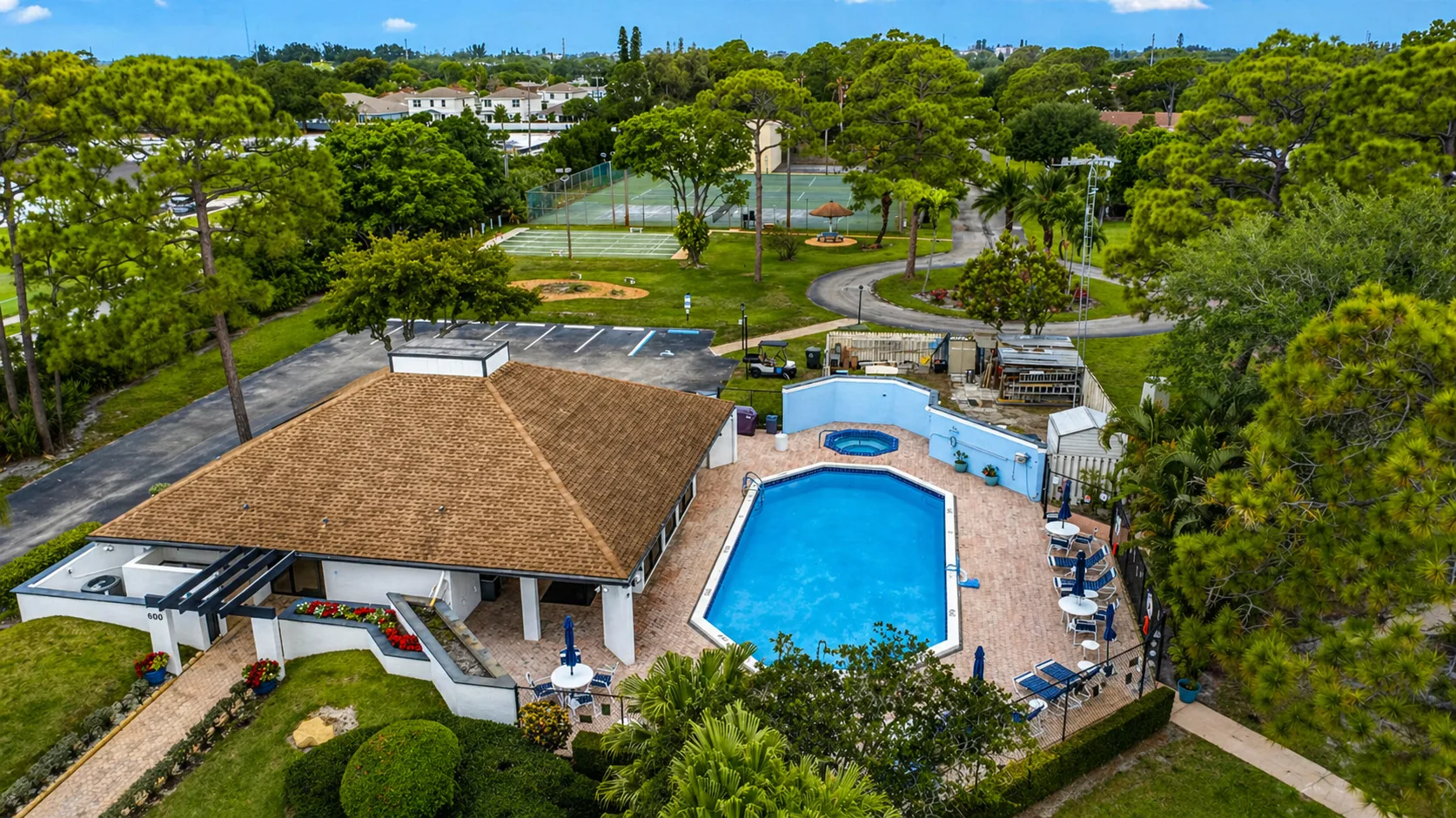 Community pool and clubhouse at Villages of Woodlake 2, Greenacres