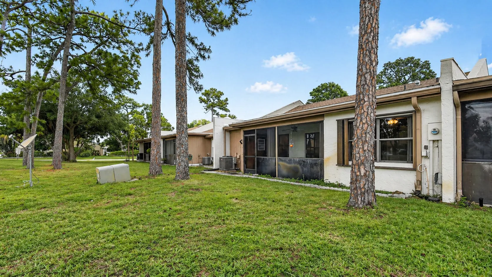 Backyard and screened lanai at 6105 Fairfield Circle