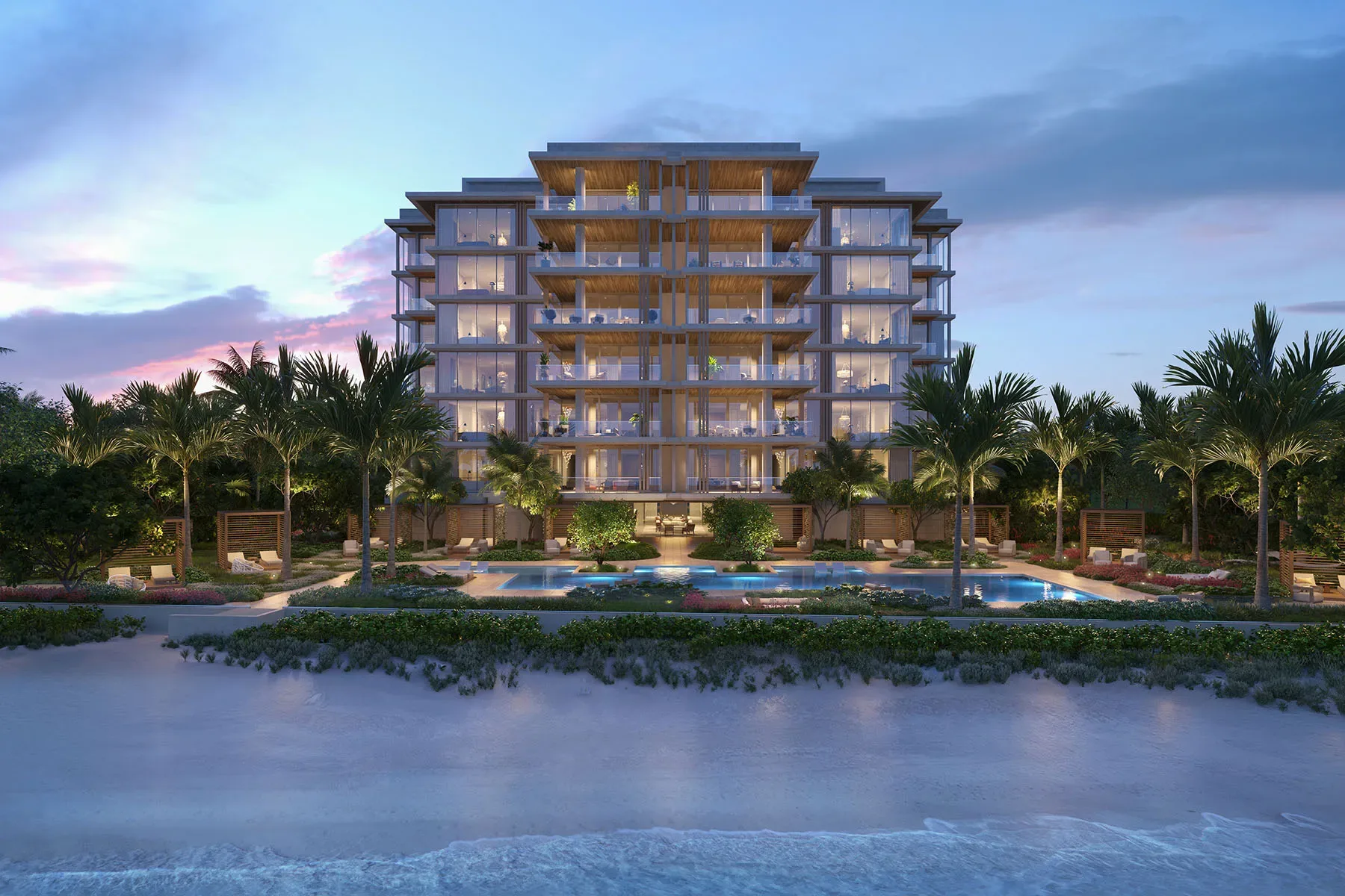 Beachfront condo exterior in Coquina Sands at golden hour with pool and palm trees