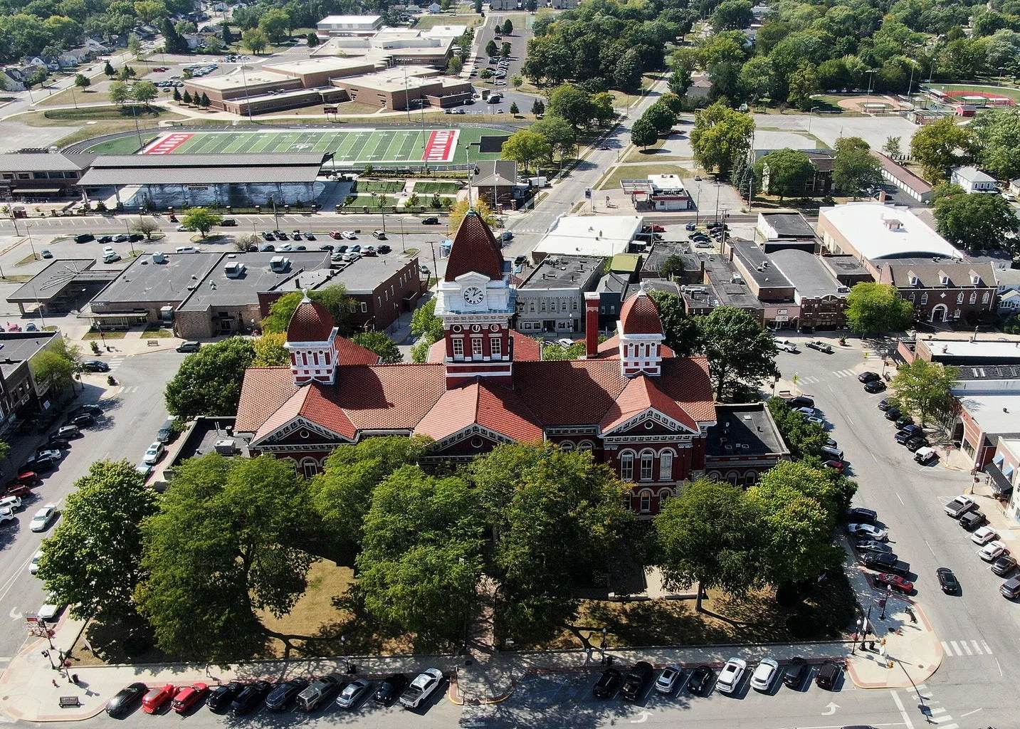 Old Lake County Courthouse in Crown Point, Indiana, its red clock tower rising above the downtown square