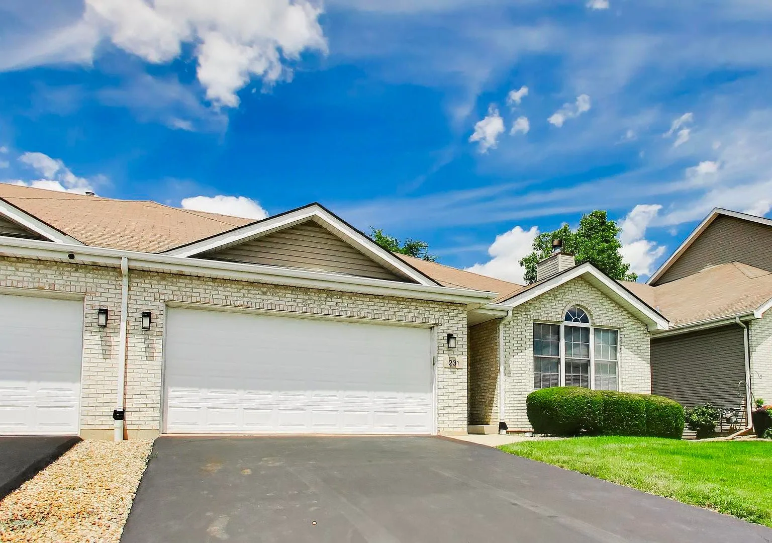 Front facade of the ranch townhome at 231 Hillcrest Lane in Steger, Illinois