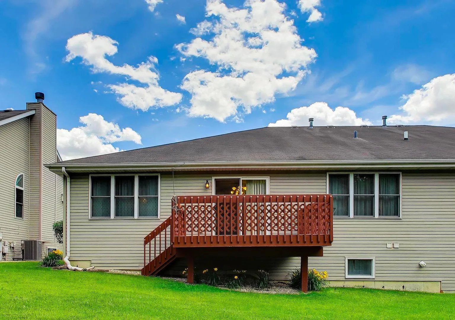 Private deck overlooking mature trees at 231 Hillcrest Lane
