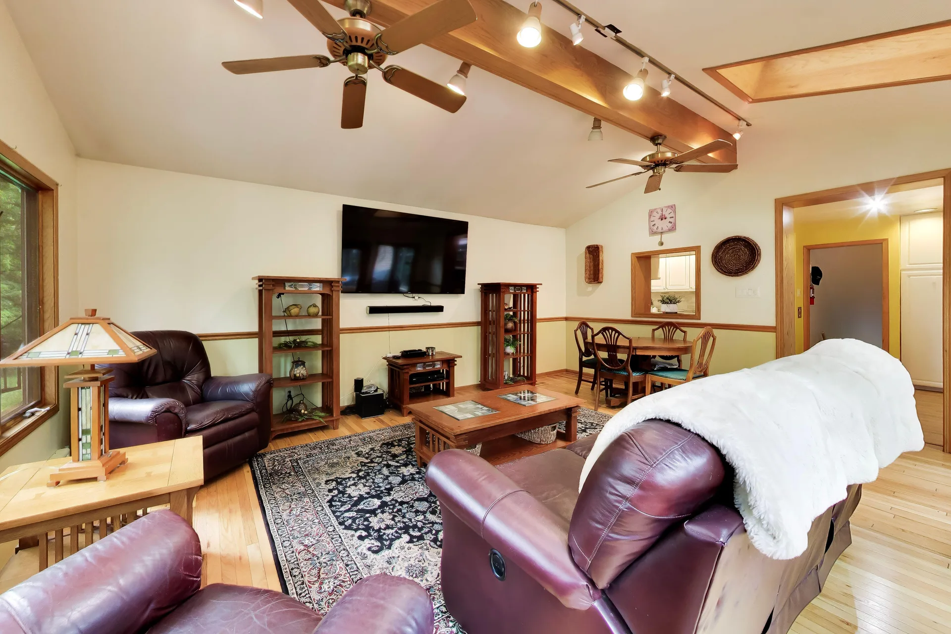 Living room with vaulted ceiling and exposed wood beams