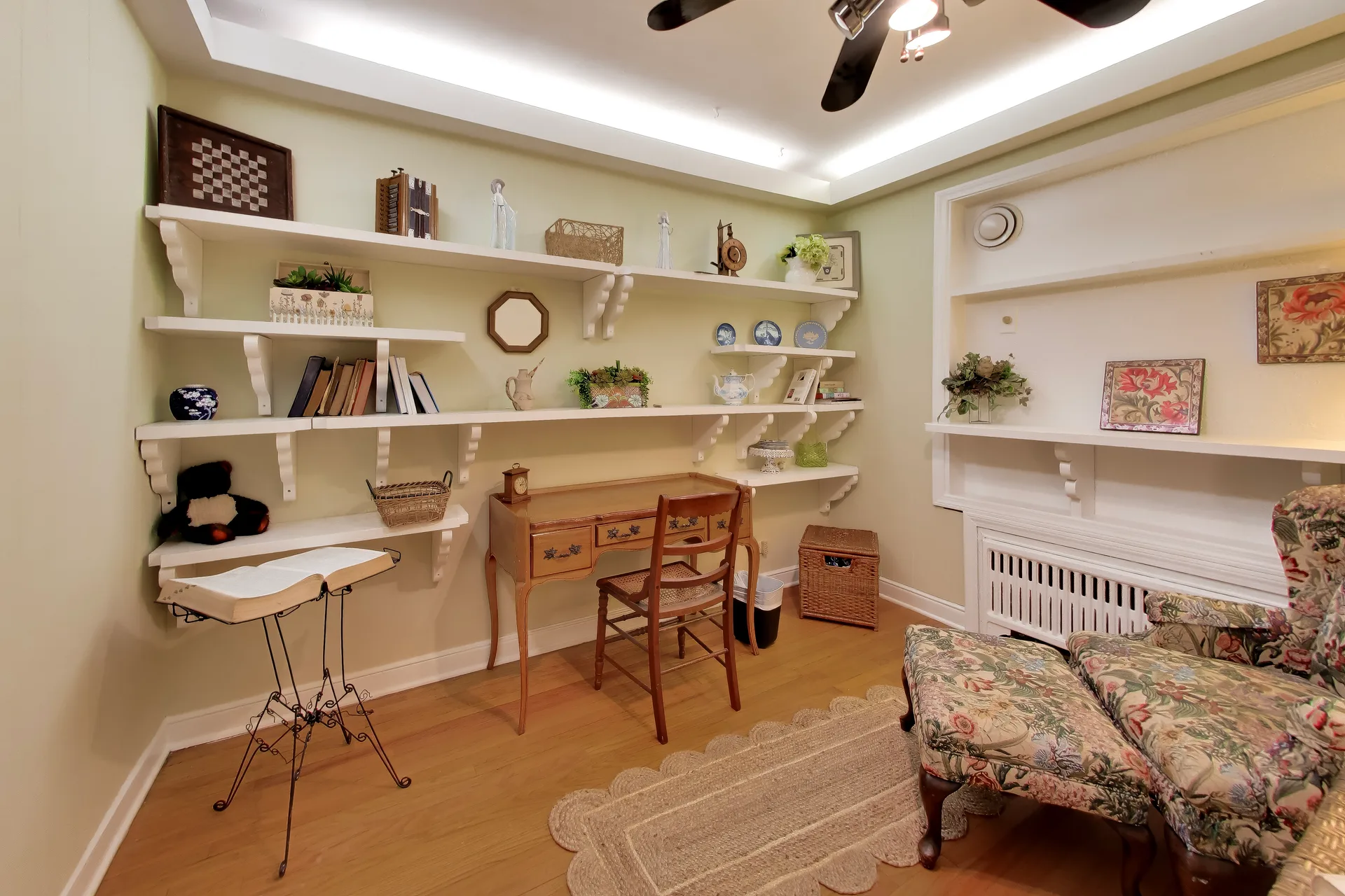 Study with pale green walls, crown molding, and recessed lights