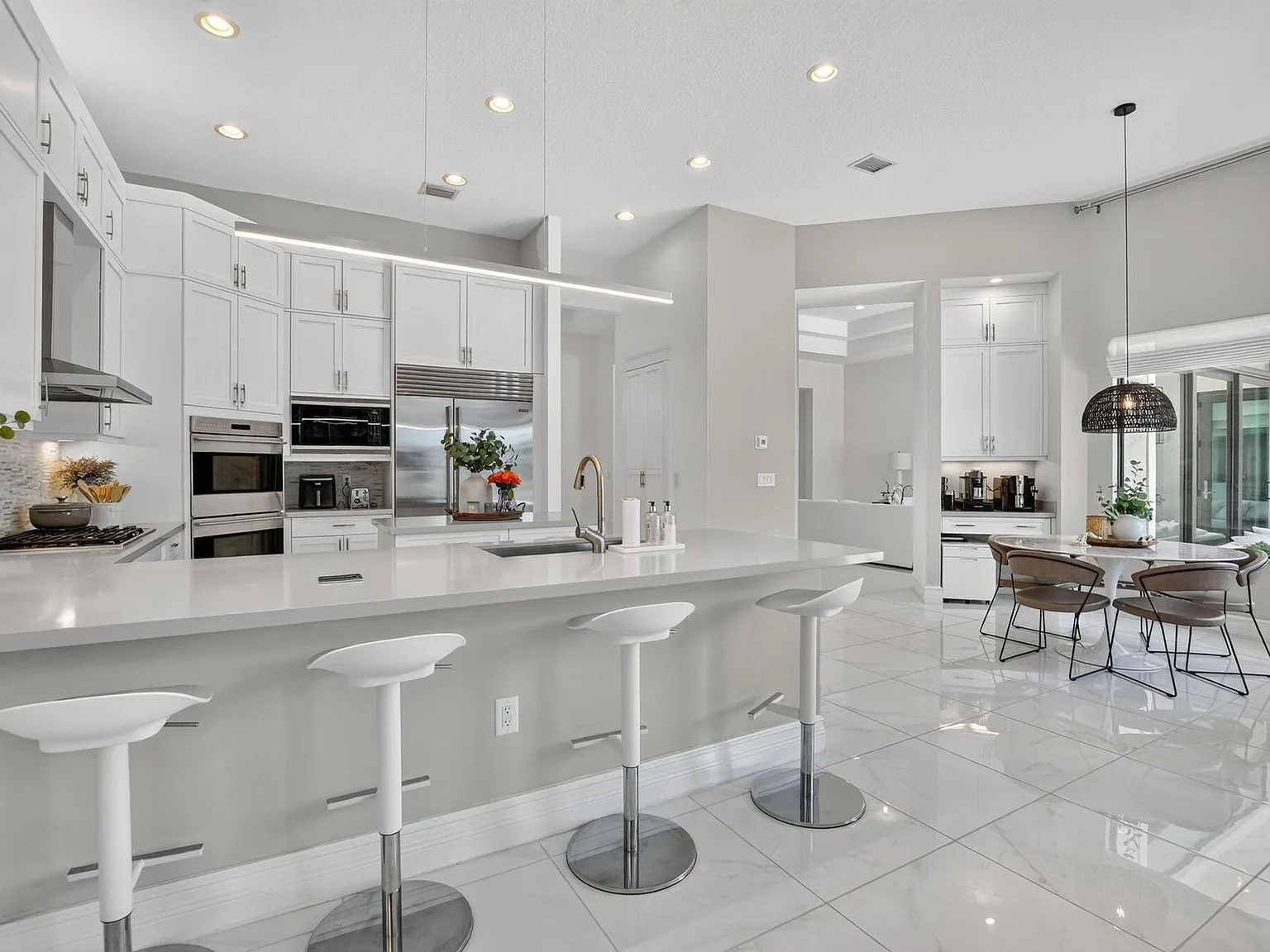 The kitchen at 16740 Strasbourg Lane with a breakfast bar adjoining the dining area