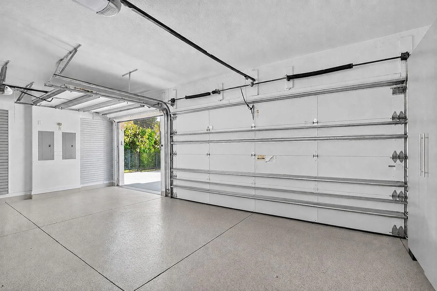 The three-car garage at 16740 Strasbourg Lane with an epoxy-finished floor