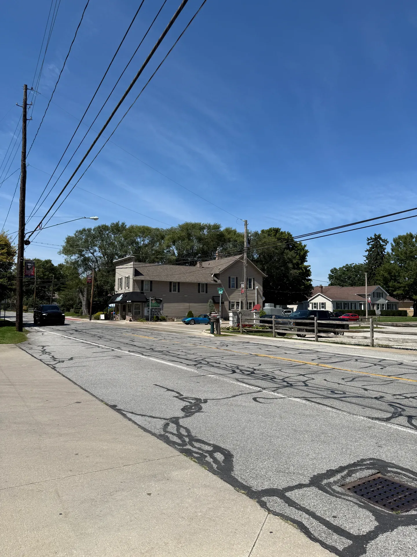 Street view of a building and road in Valley City with a clear blue sky