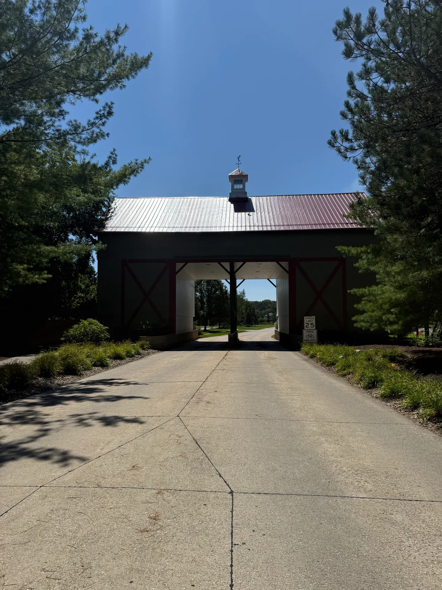 Rustic barn-style gatehouse at the drive-through entry to Barn Run in Valley City