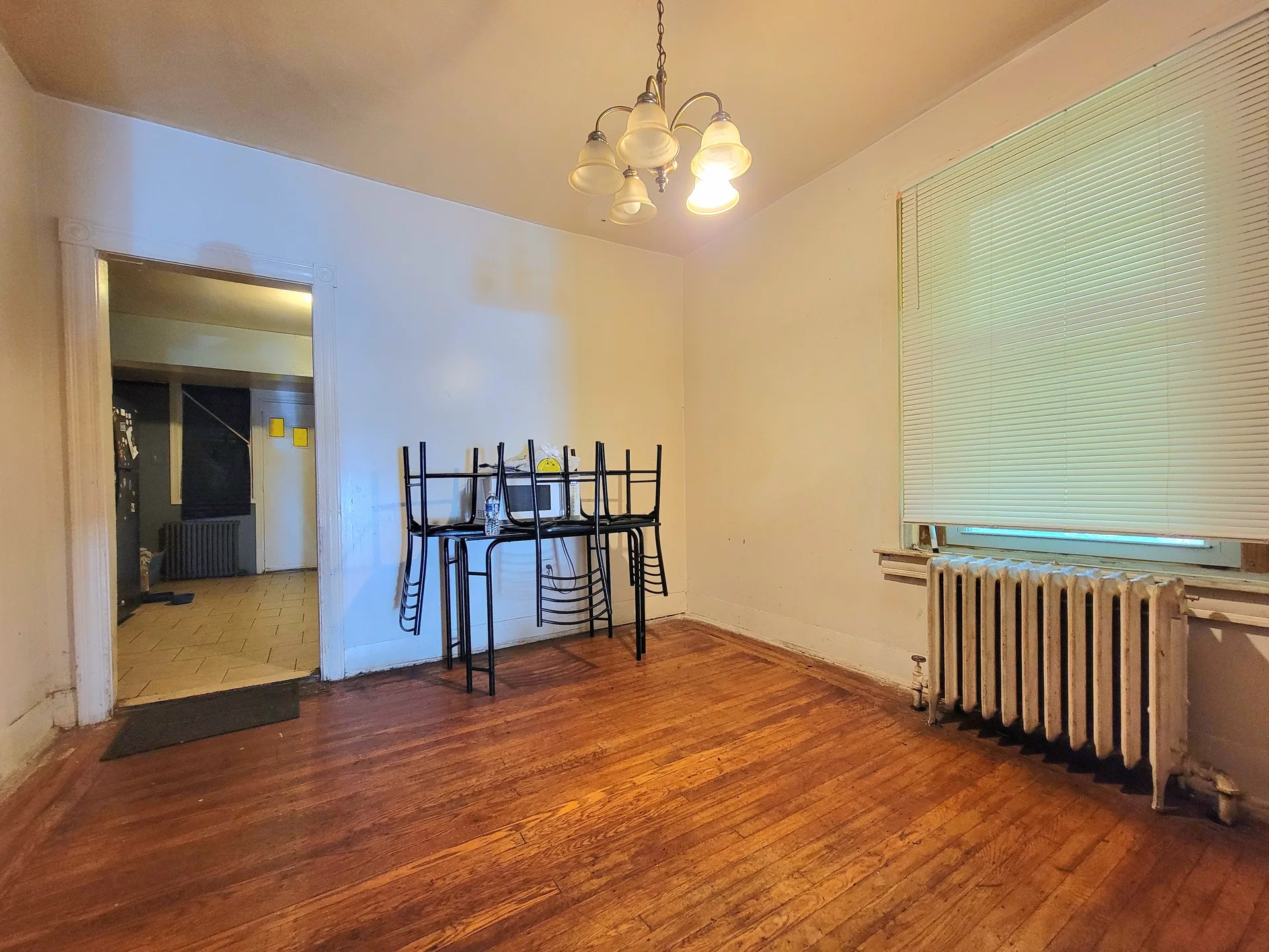 Dining room with hardwood floors and natural daylight in a traditional Philadelphia home like those in Somerton