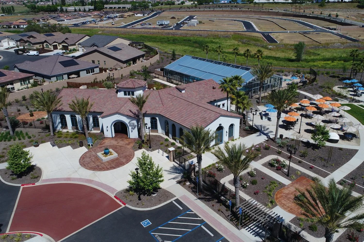 Aerial view of a community clubhouse and pool complex in a Northern California 55+ community
