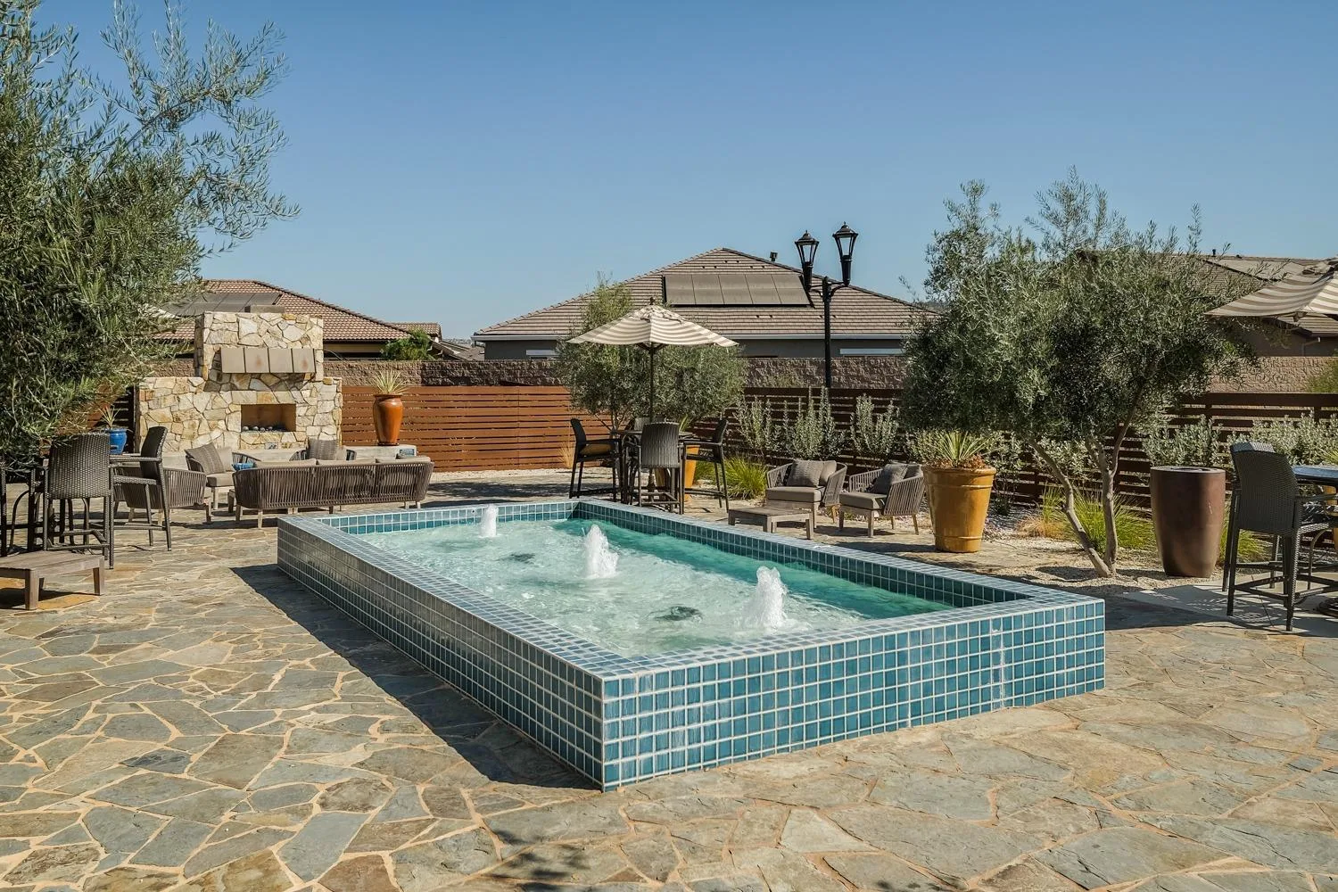 A backyard pool and patio at Heritage El Dorado Hills in El Dorado Hills, California