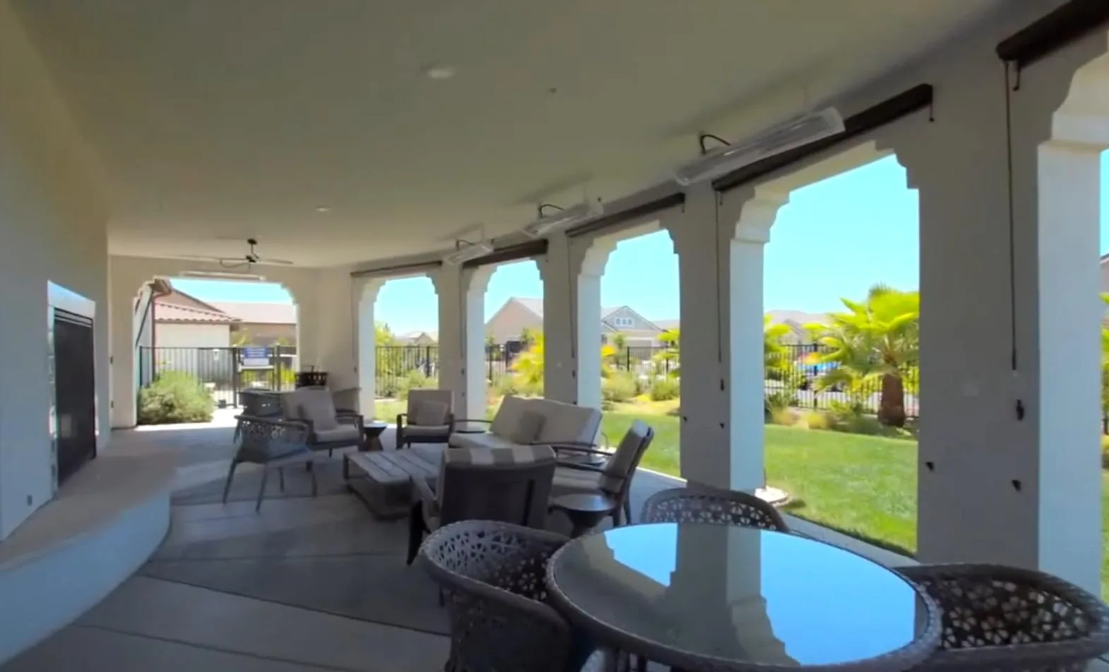 A covered outdoor patio with fireplace at a Toll Brothers 55+ community in the San Joaquin Valley.