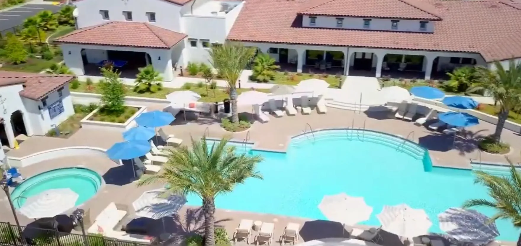Aerial view of a community pool and patio area at a Four Seasons 55+ community in Rancho Cordova.