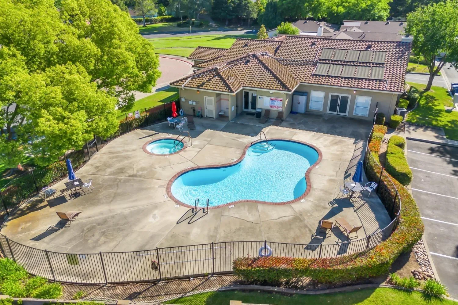 Aerial view of the community pool and spa at Del Webb Woodbridge, the 55+ active-adult community in Manteca, California
