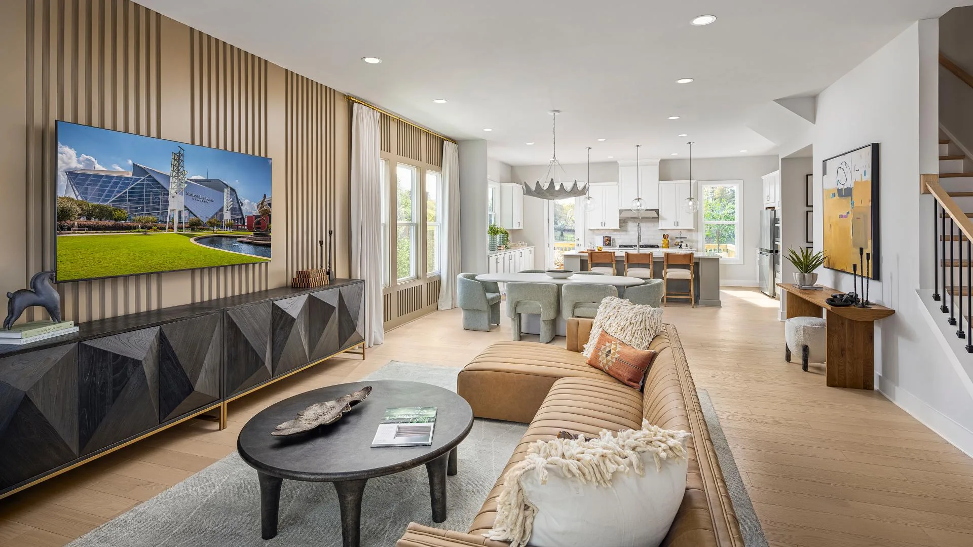 Open-concept living and dining area in a modern 55+ home