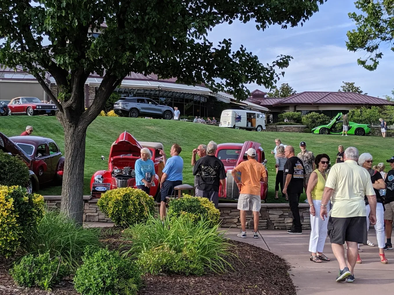 Community event on the lawn with classic cars on display