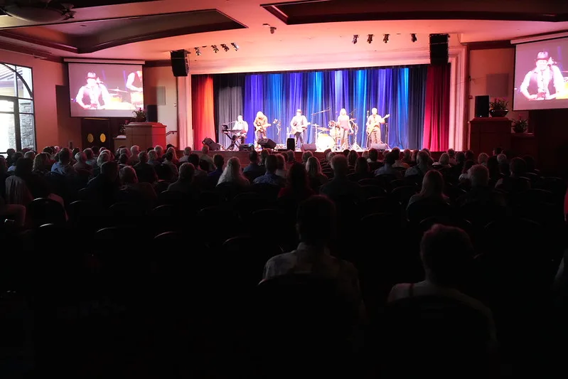 Auditorium and performance space inside a 55+ community clubhouse