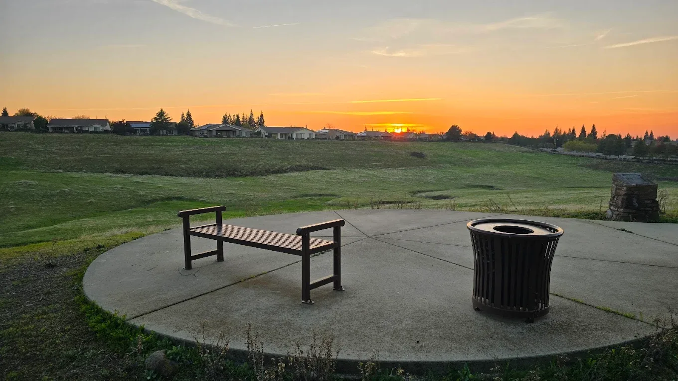 Community park overlooking a neighborhood at sunset in a 55+ community