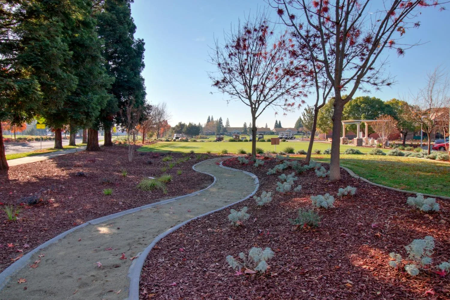 Walking trail at Sun City Roseville in Roseville, California, with landscaped common grounds