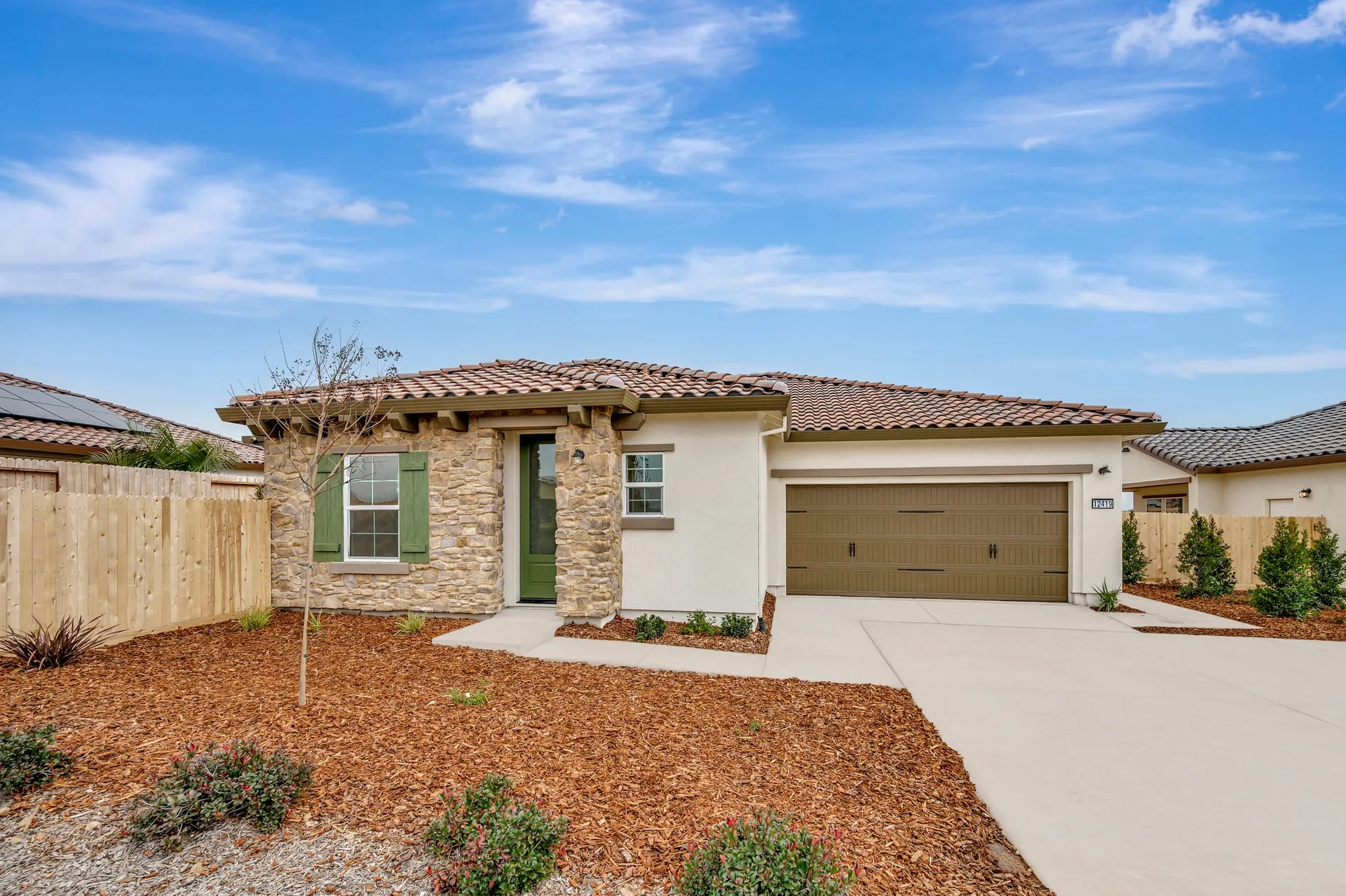 A brand-new single-story stucco home in a Northern California 55+ community