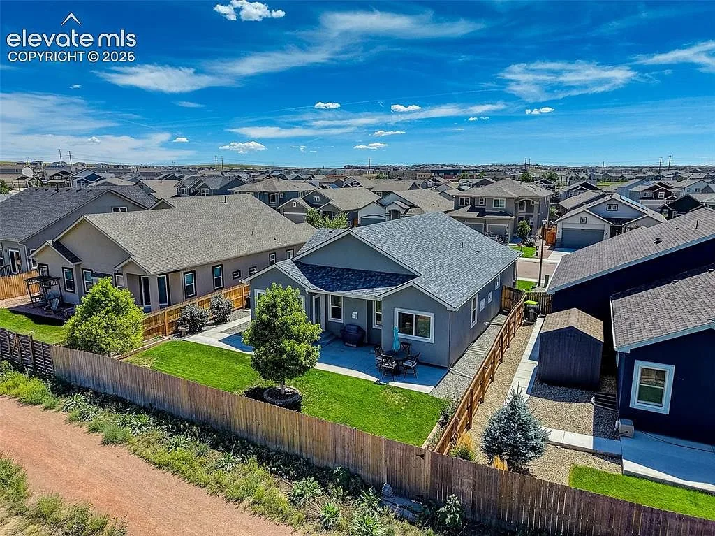 Drone aerial view looking down at the backyard and patio