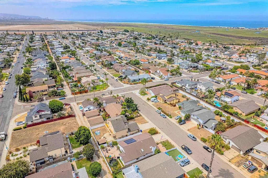 Aerial view of an Imperial Beach coastal neighborhood with single-family homes near the ocean