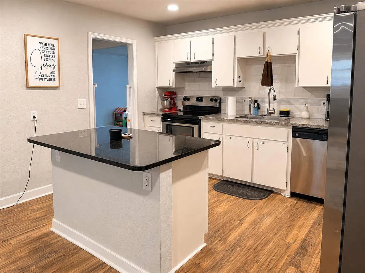 Modern kitchen with wood-look floors