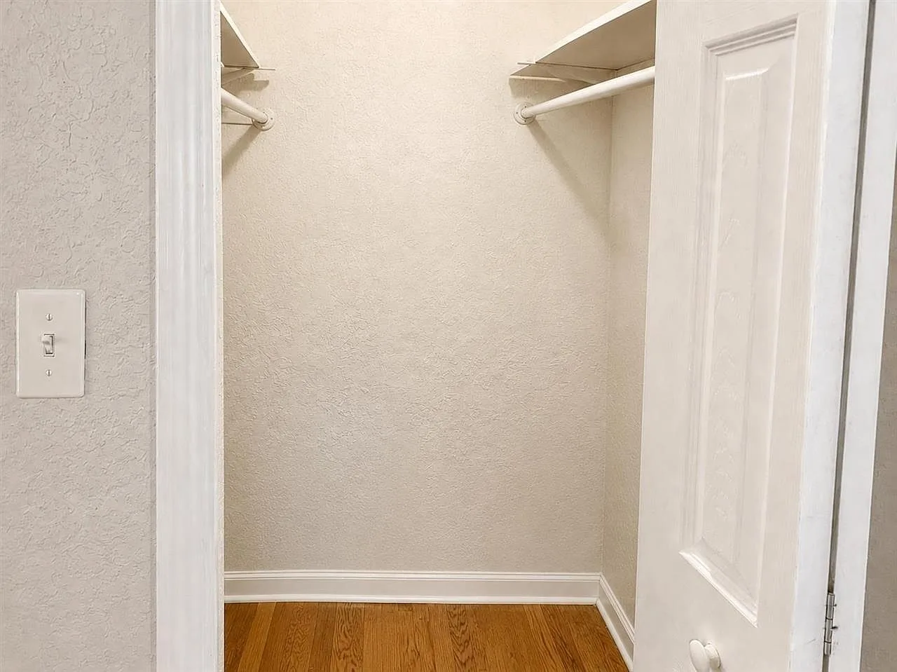 Walk-in closet with hardwoods