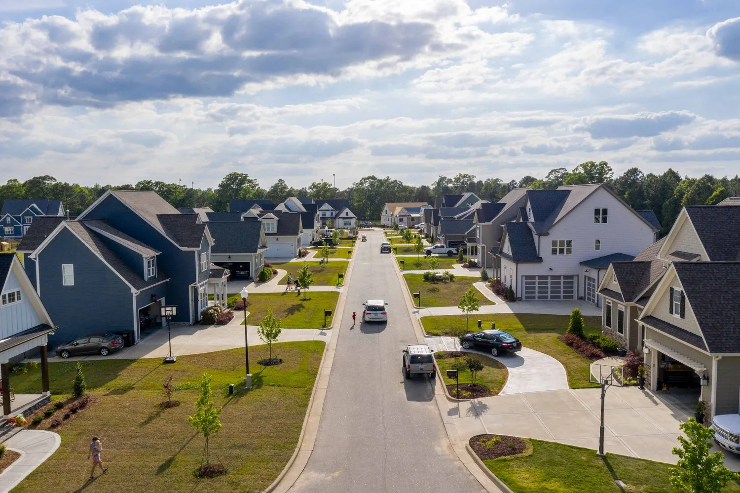 Manicured streetscape in a modern Holly Springs NC master-planned neighborhood