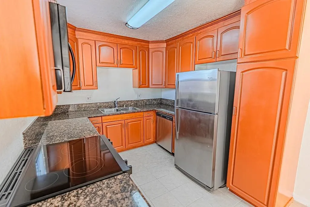 Kitchen with stainless steel appliances at 1085 12th St Unit F