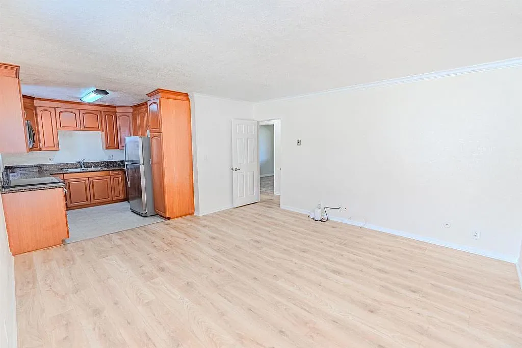 Open-concept kitchen and living area at 1085 12th St Unit F