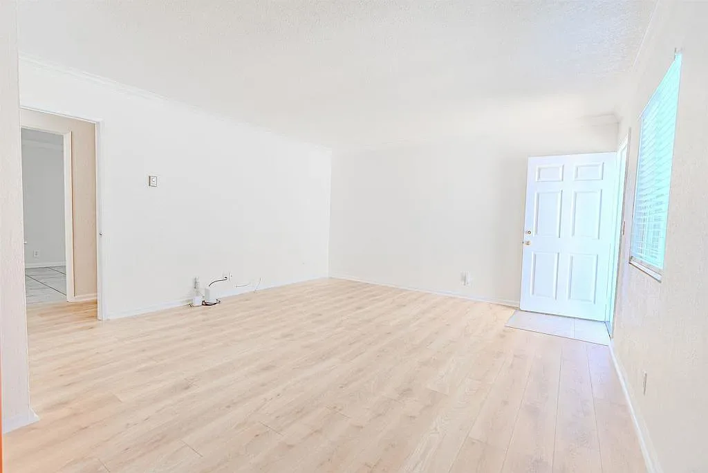 Vacant living room with luxury vinyl flooring at 1085 12th St Unit F