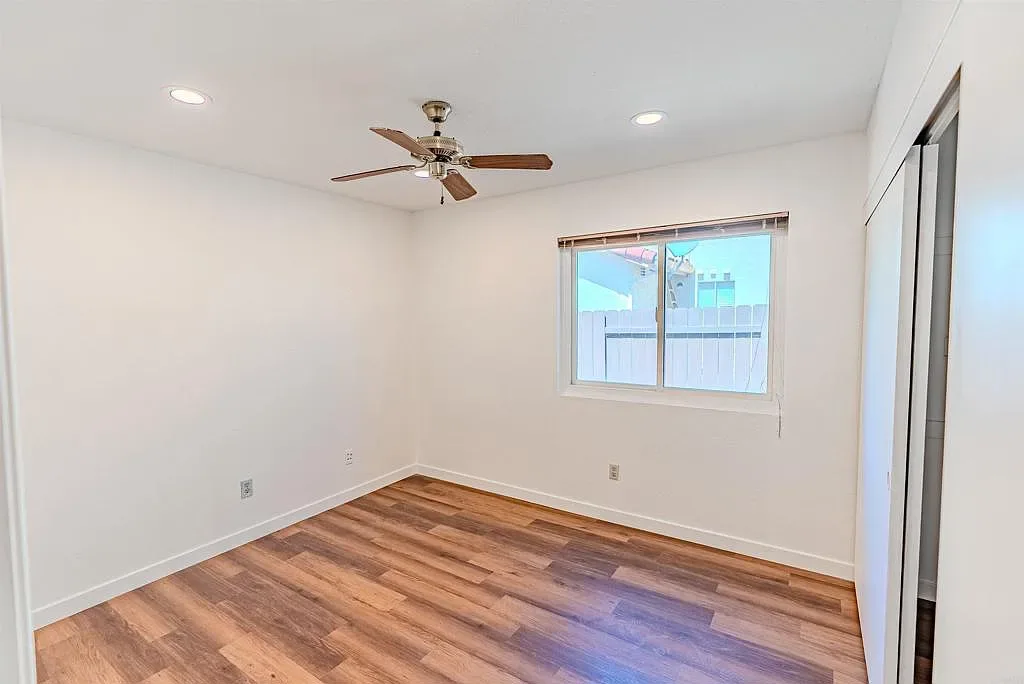 Bedroom with wood-look flooring and recessed lighting at 637 Redlands Pl