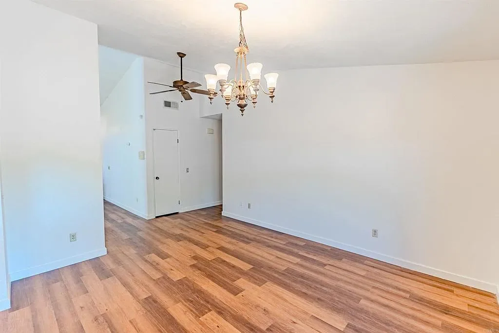 Dining room with white walls and wood flooring at 637 Redlands Pl