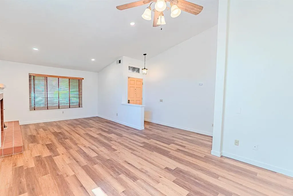 Living room with high ceilings at the entry of 637 Redlands Pl