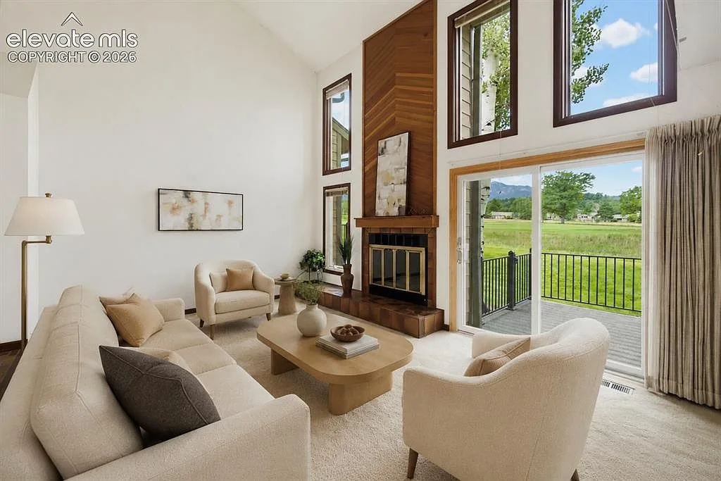 Floor-to-ceiling fireplace in the vaulted living room
