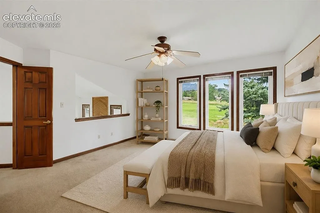 Primary bedroom with a golf course view