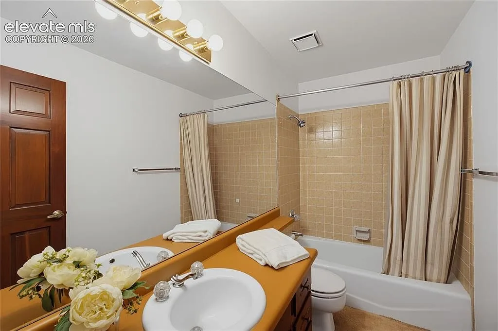 Bathroom with tub and vanity