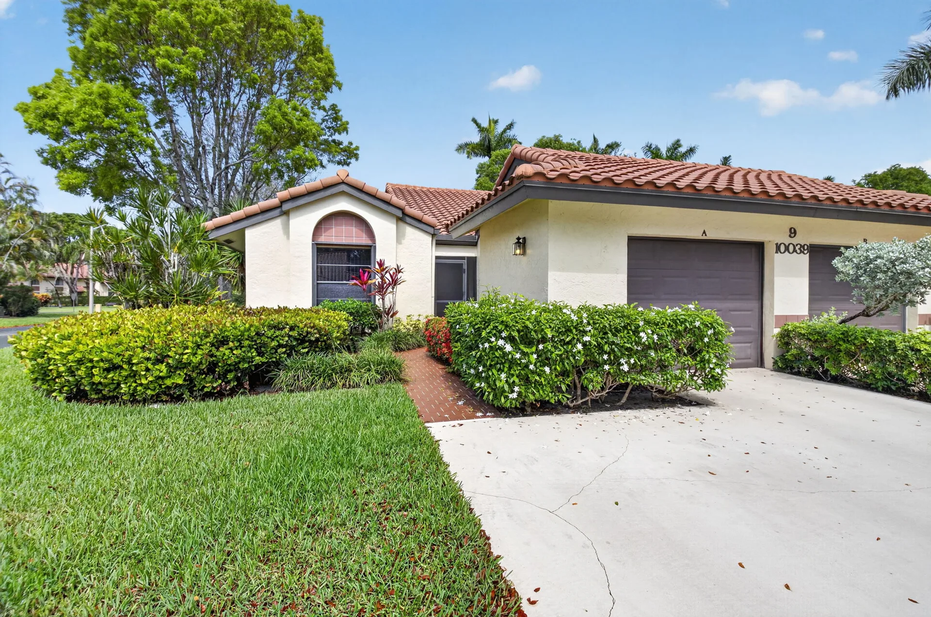 Exterior of the single-story villa at 10039 Andrea Lane A in Boynton Beach