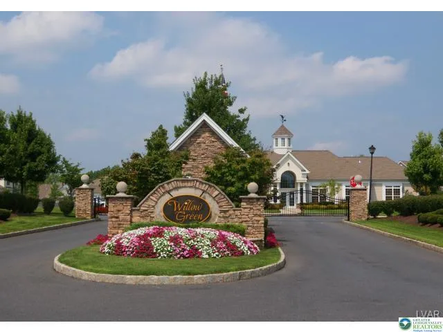 Willow Green community entrance sign with stone walls and landscaping in Northampton, PA