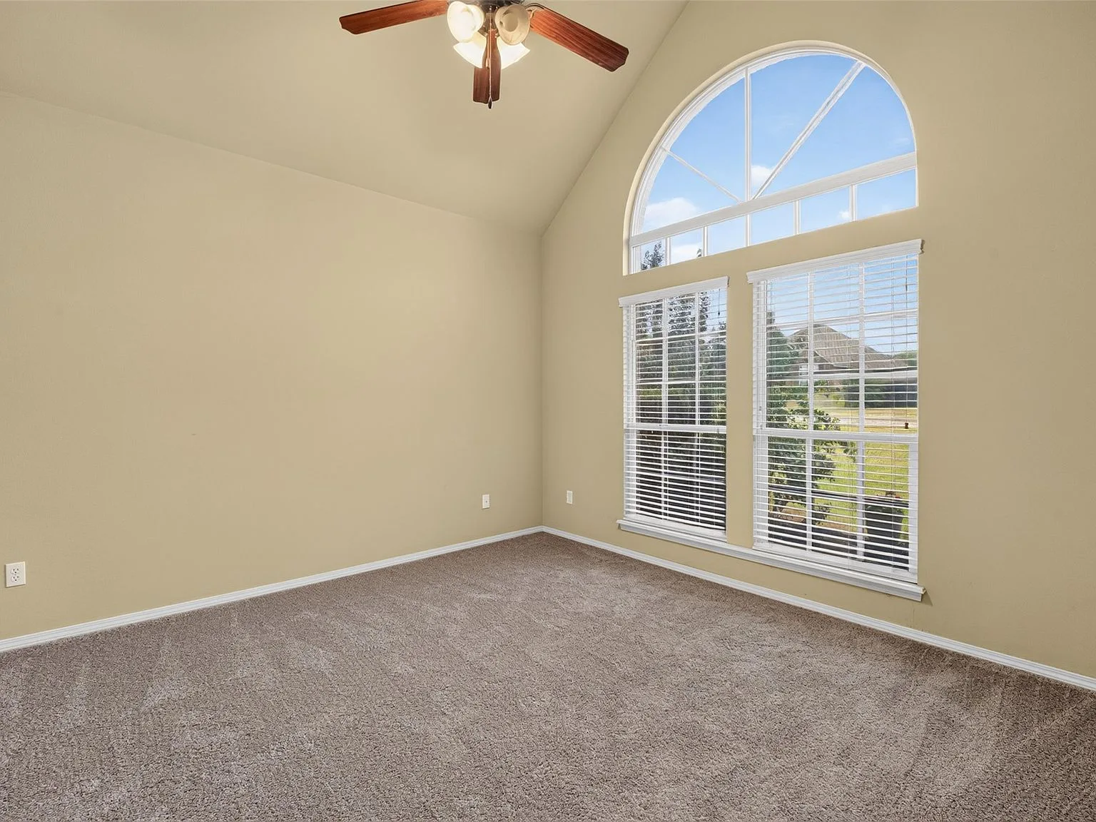 Bedroom with vaulted ceiling