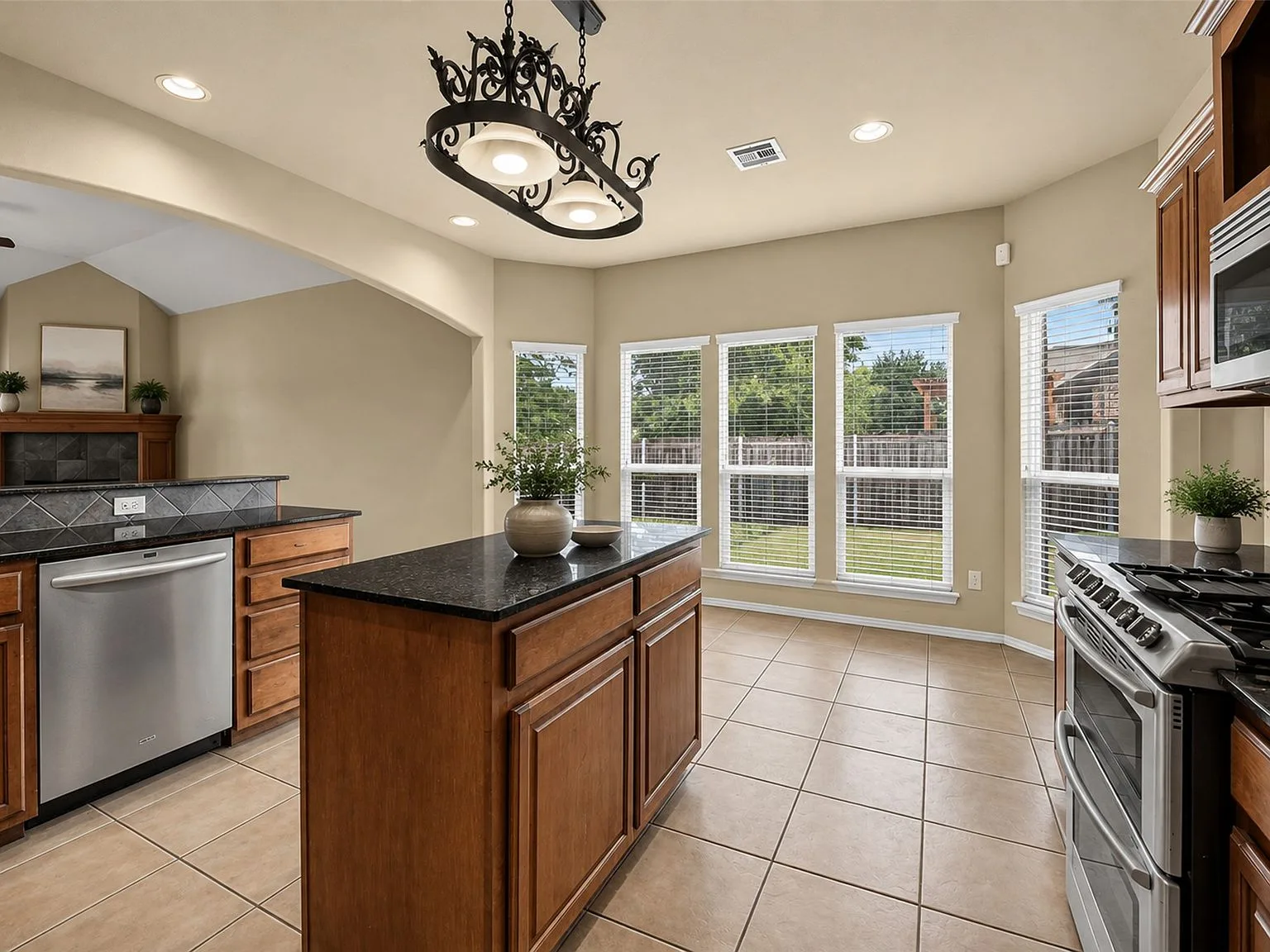 Kitchen island and breakfast nook with granite countertops