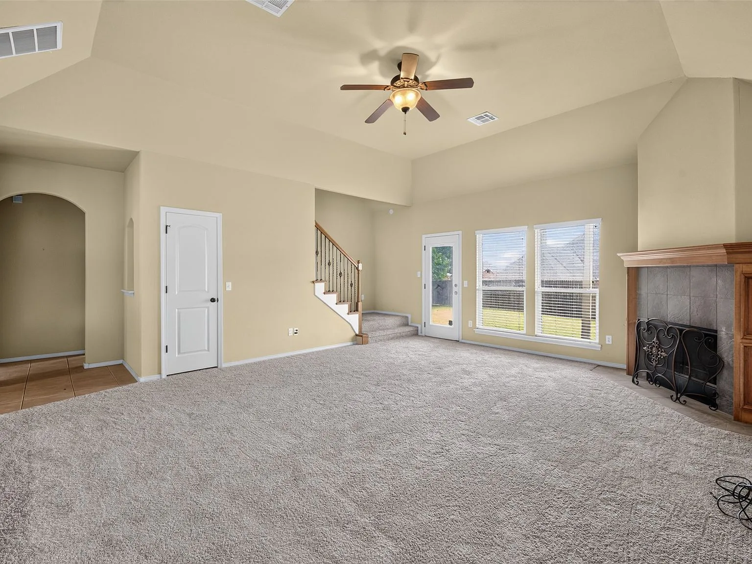 Vaulted-ceiling great room with fireplace at 4604 N Narcissus Ave