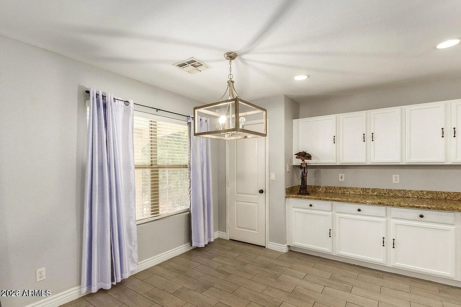 Breakfast area with white shaker cabinetry