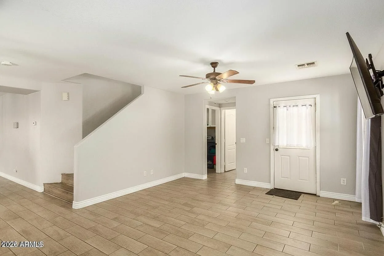 Living room and entryway with bright natural light