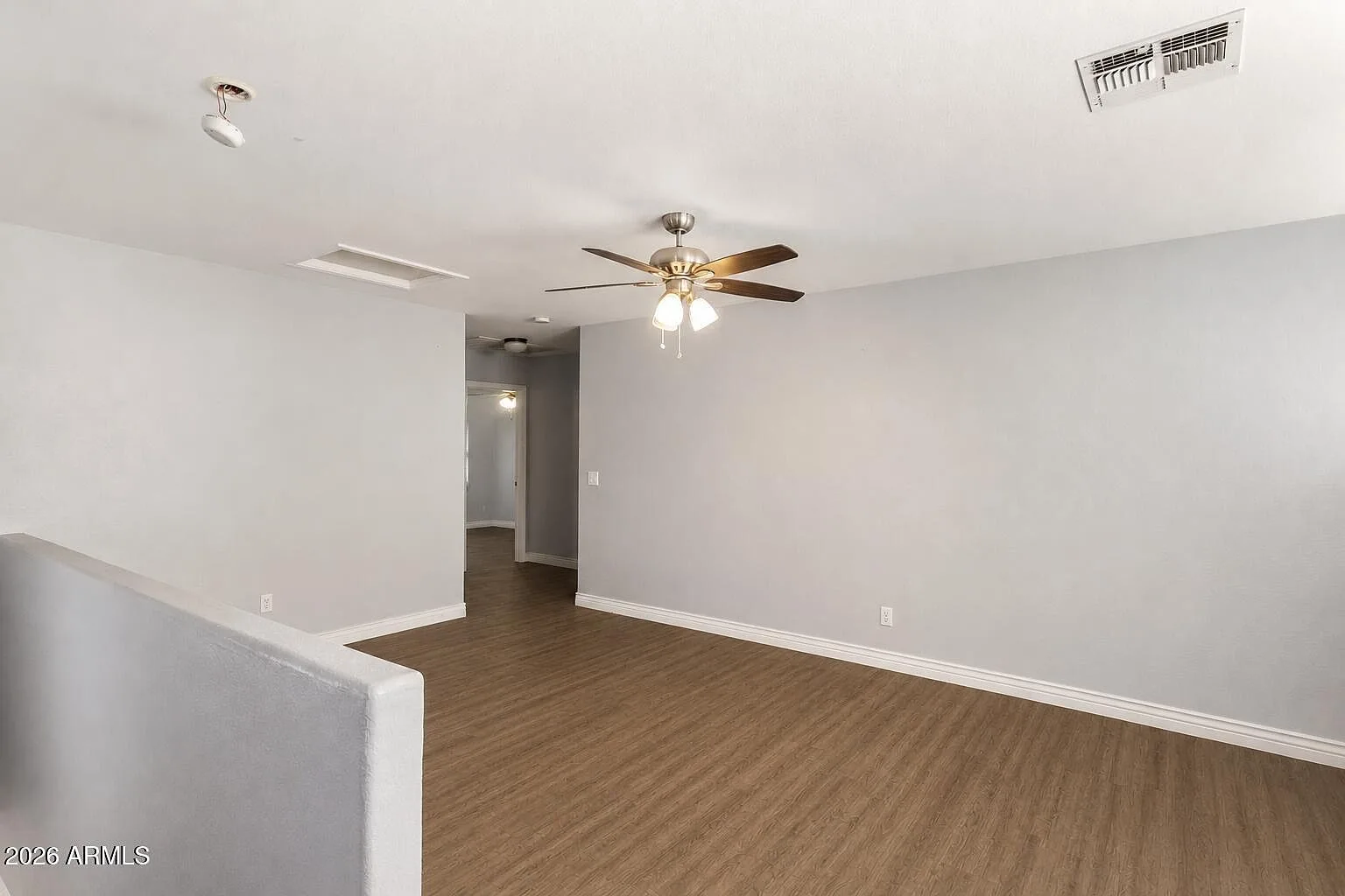 Upstairs loft with wood-look plank flooring