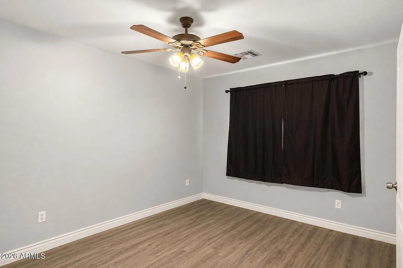 Secondary bedroom with neutral paint