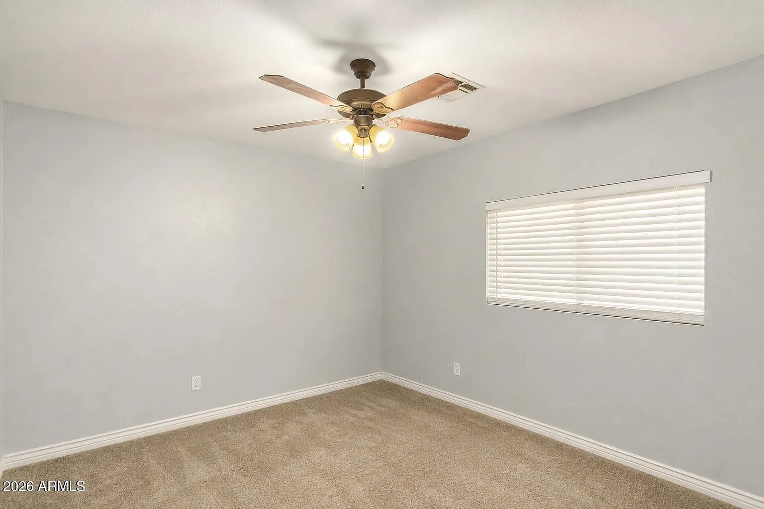 Bright bedroom with carpet and white trim